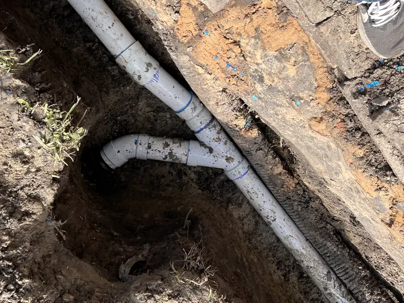 Old cast iron out, new PVC in, yard put back