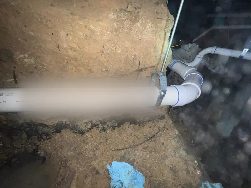 A new main hung the length of a hand-dug tunnel